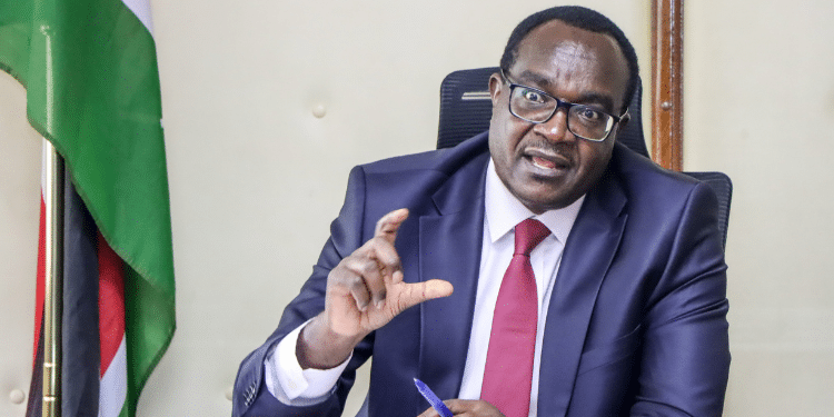 Education Cabinet Secretary Julius Ogamba Migos Speaks In A Past Meeting. Photo/ Edumin 