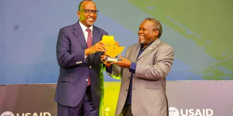 Macharia Gaitho Receives Award From Environment Cs Aden Duale. Photo/ Duale