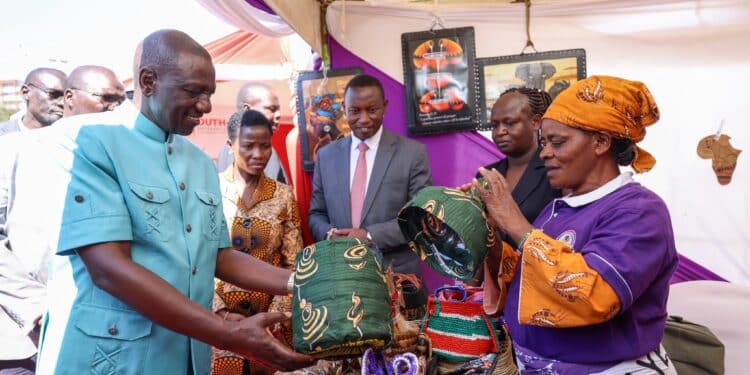 President William Ruto (Left) Interacts With Traders During The Anniversary Of Hustler Fund In Nairobi. Photo/Pcs