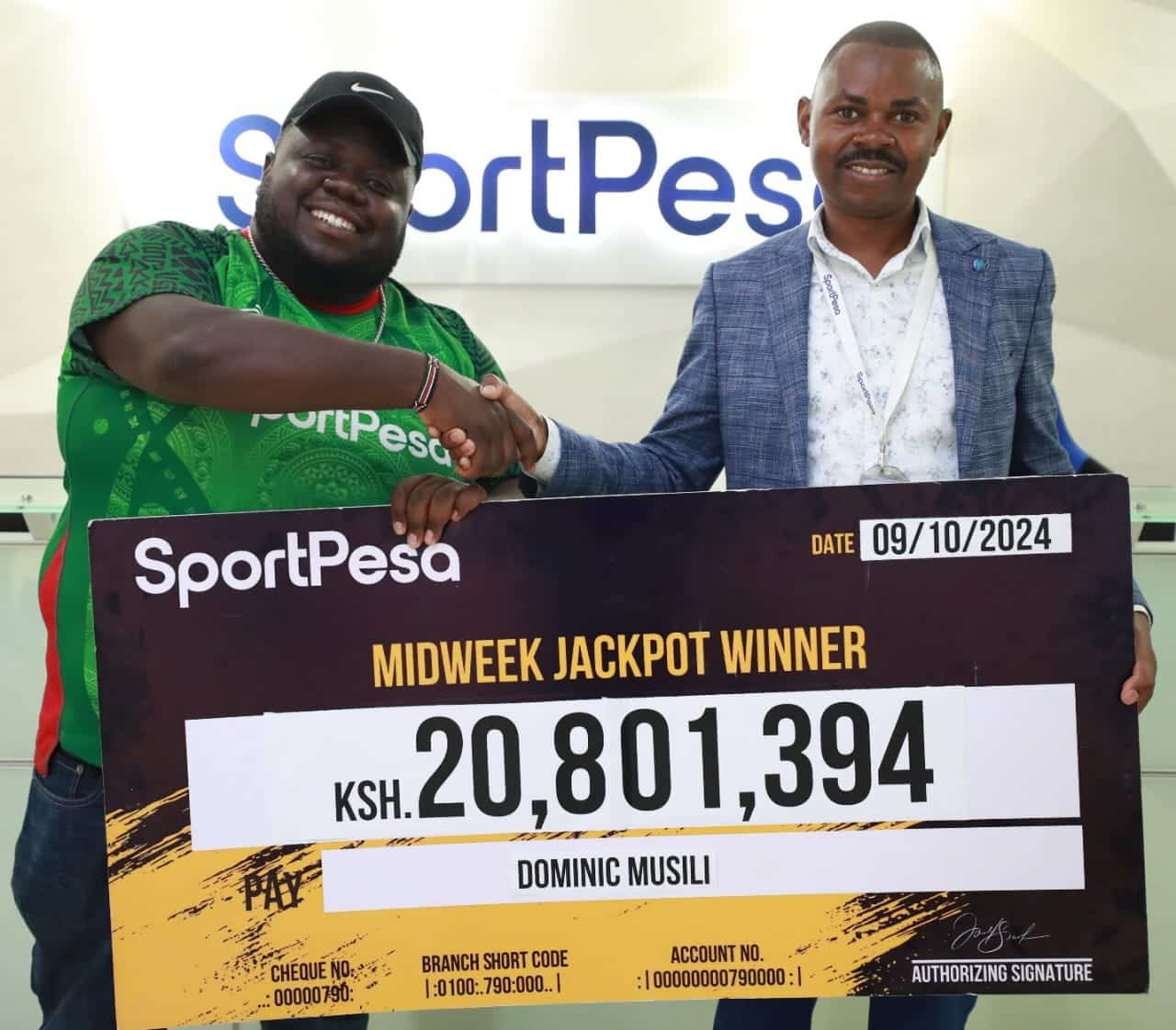 Dominic Musili (Left) Unveiled As The Winner Of A Of Ksh 20,801,394 In The Midweek Jackpot. Photo/ Sportpesa