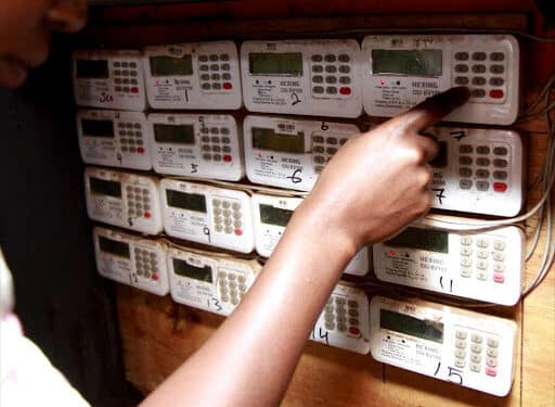 A Customer In Loresho, Nairobi, Keys In Tokens In Her Meter Box. Photo/ Star