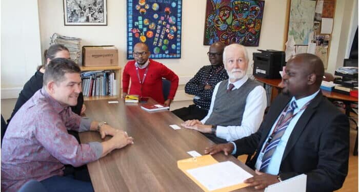 William Pike At A Staff Meeting