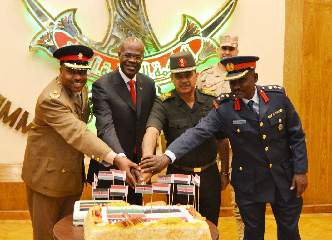 Ambassador Maj. Gen. Joff Otieno (Kaf Rtd), Gen. Abdelmanam Abdelhamid, The College Commandant, Col. Ali Of Kaf And Major Mohamed Cutting The Cake After The Presentation.