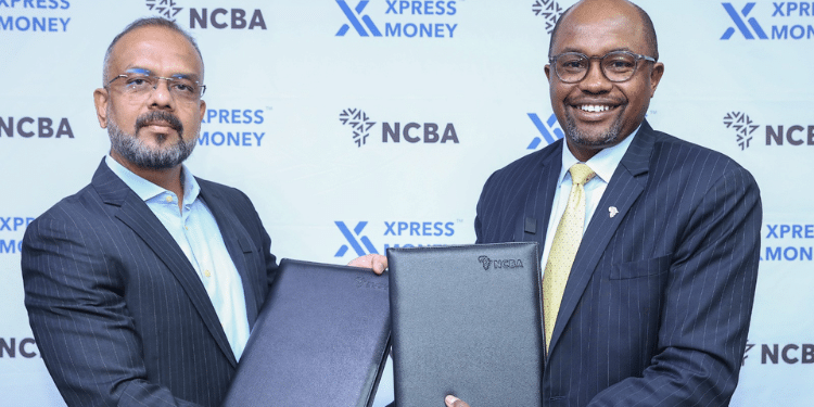 Ncba Group Retail Director, Tirus Mwithiga (Center) With Xpress. Money Ceo, Samir Vidhate Exchange Documents During A Memorandum Of Understanding Signing Between Ncba And Xpress Money At Ncba House. Photo/ Ncba