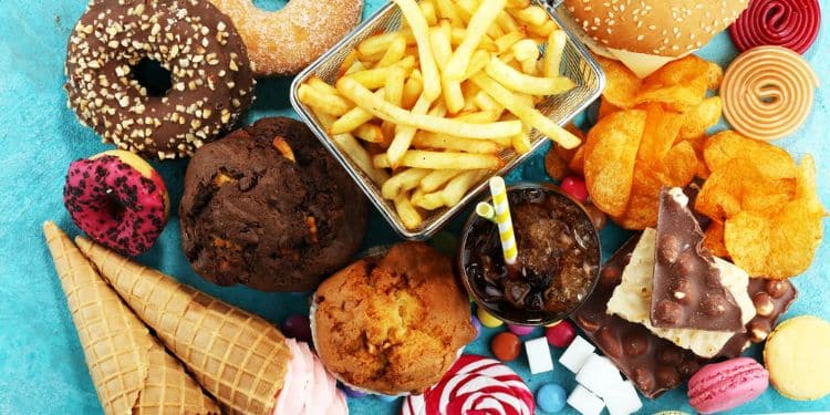 Junk Food Spread On A Table. Junk Food Spread On A Table. Junk Food Spread On A Table.