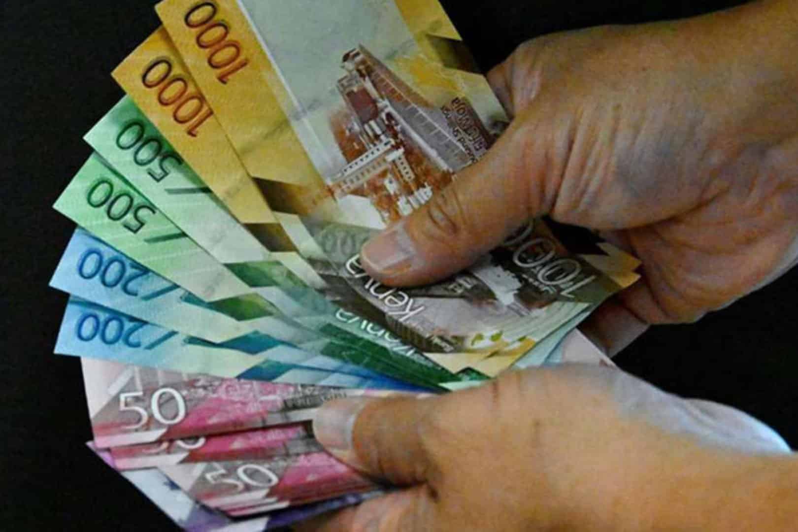 Someone Holding Kenya Banknotes