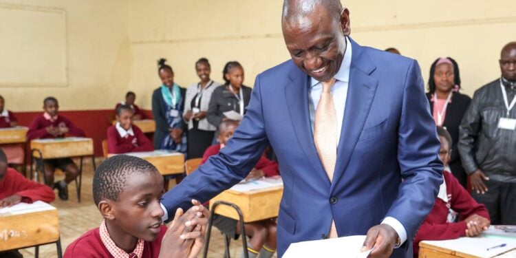 Kenya’s President William Ruto Administering Exam Papers During A Past National Test. Photo/Pcs. 