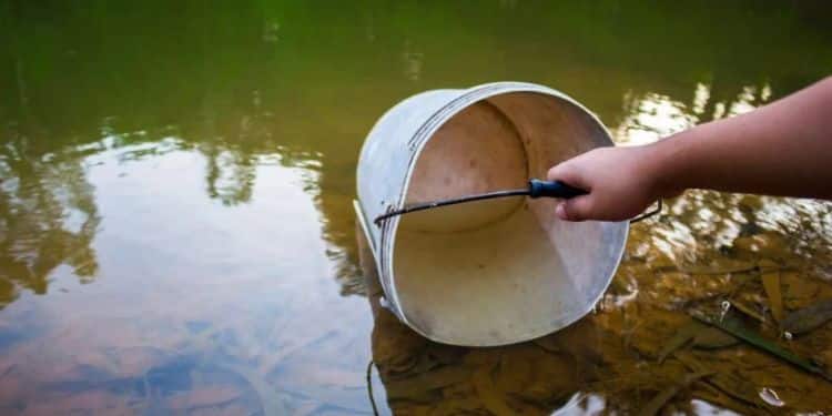 Makueni Bans Women On Monthly Periods From Fetching Water A Person Fetching Water.