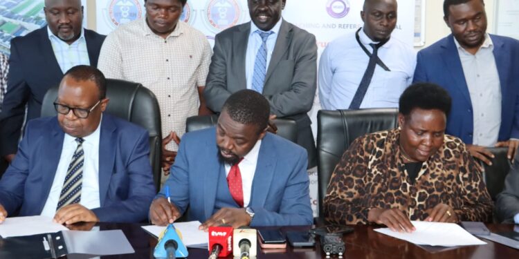 Doctors Secure Permanent Jobs, Enhanced Packages After Strike Kmpdu Secretary General Dr. Davji Bhimji Atellah Signinh Rtwf With Mtrh Officials At The Facility On February 11, 2024. Photo/ Atellah Doctors