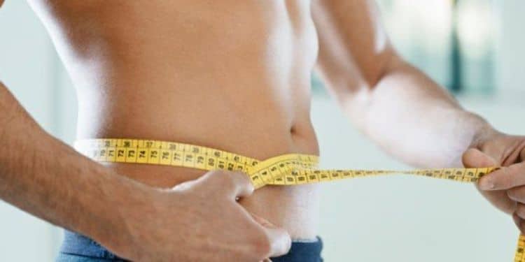 A Man Measuring His Waist. 