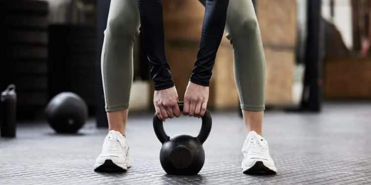 A Woman Lifting A Dumbbell. 