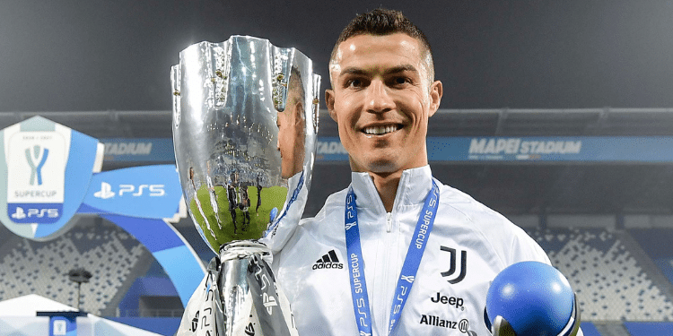 Cristiano Ronaldo Holding A Trophy During The 2020/21 Italian League Season. Photo/Champions League X.