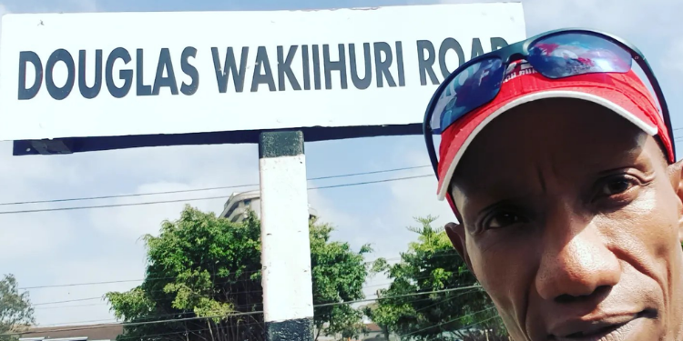 Meet Douglas Wakiihuri, Kenya’s First Marathon Gold Medalist Athlete A Photo Of Douglas Wakiihuri Standing Near Aerodrome Road That Was Renamed To Douglas Wakiihuri Road In 2023 Photo/Douglas Wakiihuri