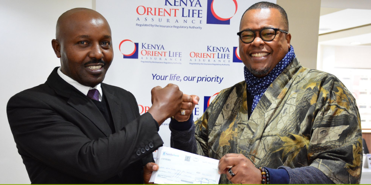 General Manager Jackson Muli Presenting A Cheque To The Rotary District 9212 Governor Alex Nyaga Photo/ Kenya Orient Life Assurance Limited