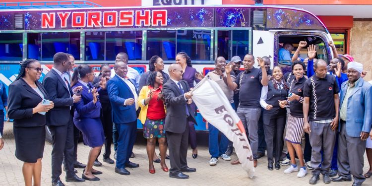  Moses Munene, Equity Bank Rongai Branch Manager Hands Over A Bus To Members Of Nyoroma Self Help Group Outside Equity Bank Kenya Rongai Branch. 