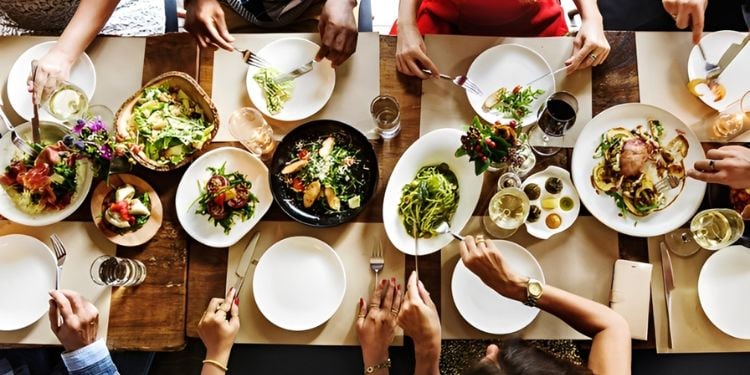A Group Of People Enjoying A Meal.