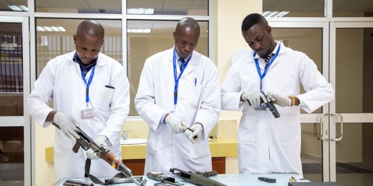 Officers At The The National Forensic Laboratory – Ballistics Section Handling Firearms.
