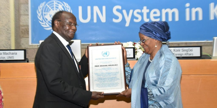 Professor Michael Ndurumo Receiving The Un In Kenya Person Of The Year Award From Director-General, Un Office At Nairobi( Unon) Mrs Zainab Hawa Bangura Photo/Un