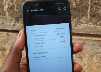 A Photo Of A User Holding A Mobile Phone Displaying Fuliza Menu. Photo/Techarena