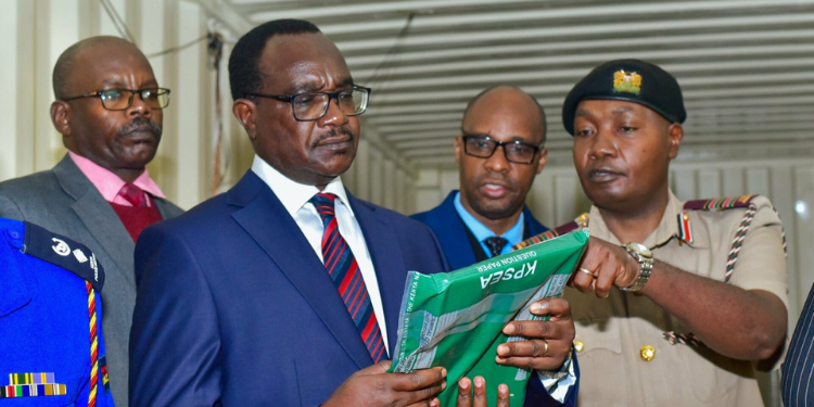 A photo of Education CS Julius Ogamba inspecting examination papers. PHOTO/KNEC